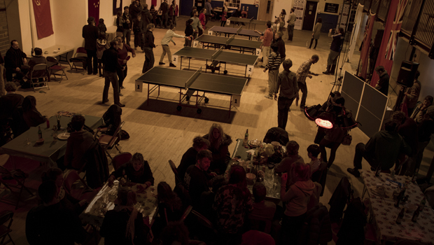 Competitors play table tennis at a Wiff Waff Wednesday event, whilst others eat food from the Drill Hall Arts Cafe.