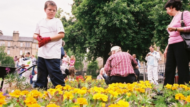 Community planting flowers in Dalmeny Street Park