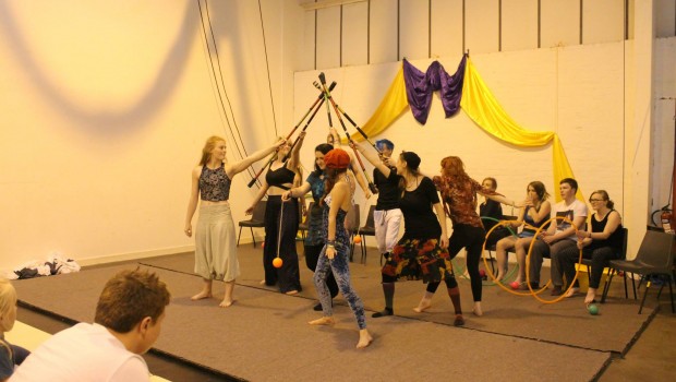 Circus performers on stage at an Edinburgh theatrical performance.