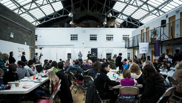 Large groups of people attend the Leith Late event at The Out of the Blue Drill Hall regarding art in Leith and Edinburgh.