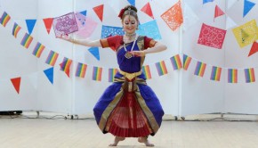 A woman performs a traditional Indian dance at the Wellbeing Mela event