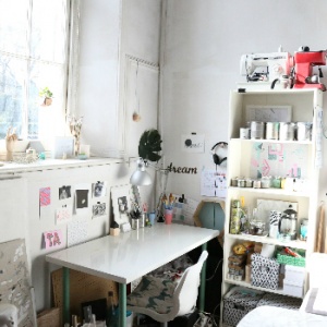 An artists' workspace at Abbeymount Studios with painted objects and the sun shining through the window overlooking Abbeyhill.