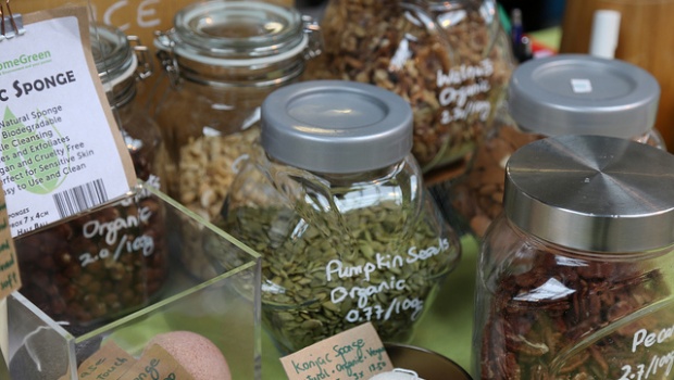 Pumpkin seeds, dried fruit and nuts in glass jars