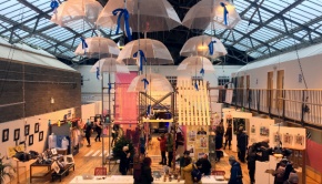 Crowds look around the Makeshift exhibition installation and various Arts Market stalls