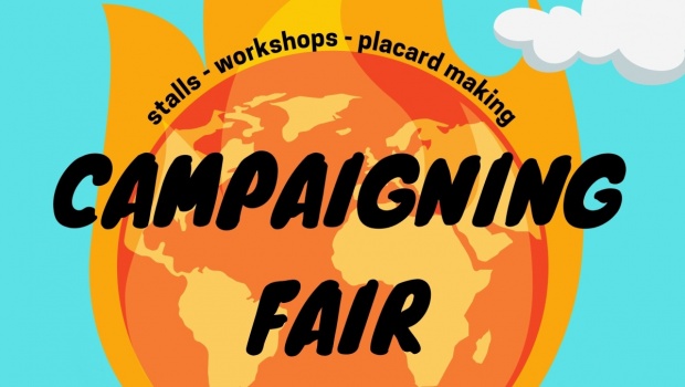 Stalls, workshops and placard-making at the Campaigning Fair. Image depicts the world on fire.